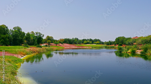 beautiful lake near the golf course in a sunny day