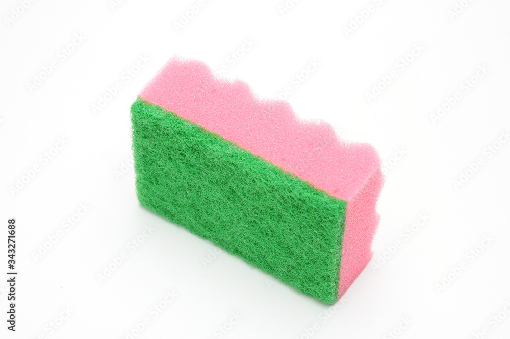 Sponge for washing dishes and plumbing on a white background Sponge for washing dishes and plumbing on a white background