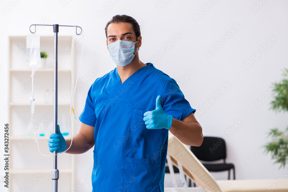Young male doctor working in the clinic Young male doctor working in the clinic