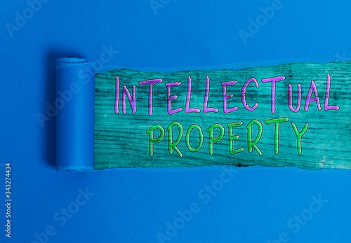 Conceptual hand writing showing Intellectual Property. Concept meaning Protect from Unauthorized use Patented work or Idea