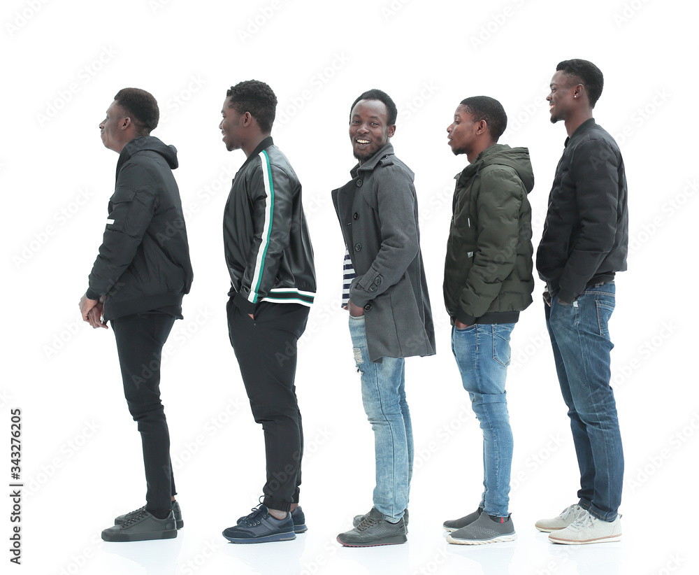 group of diverse guys standing in turns . isolated on white