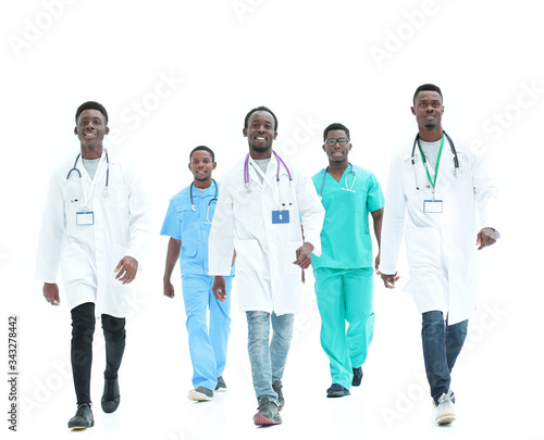 group of different doctors rush to the rescue. isolated on white