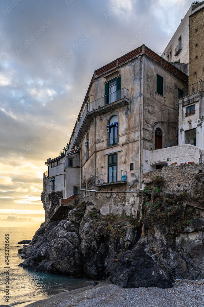 An ancient building overlooking the beach of Minori, a small town on the Amalfi Coast, Campania, Italy