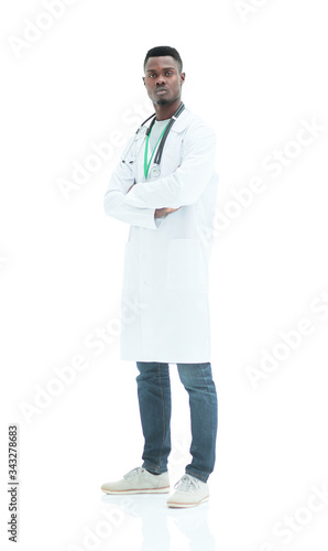 in full growth. a serious doctor in a white coat.
