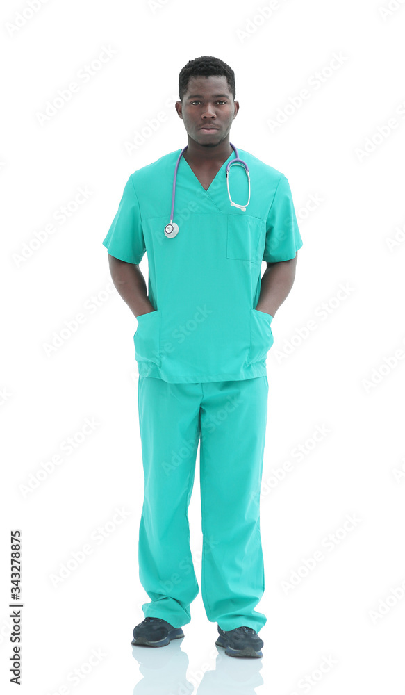 in full growth. smiling doctor in blue uniform. in full growth. smiling doctor in blue uniform.