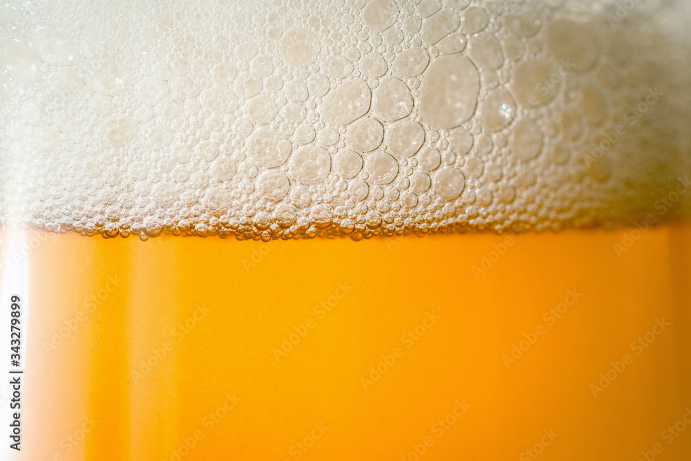 Beer with bubble froth in glass close up shot, refreshing alcohol beverage background. Beer with bubble froth in glass close up shot, refreshing alcohol beverage background.