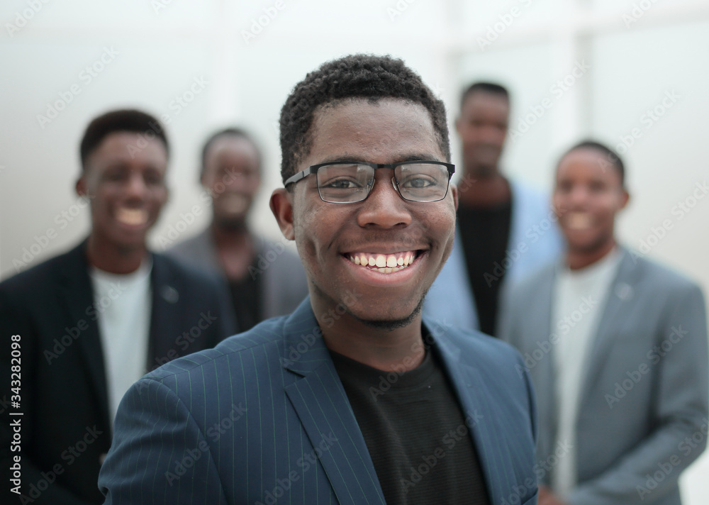young businessman pointing to his business team young businessman pointing to his business team