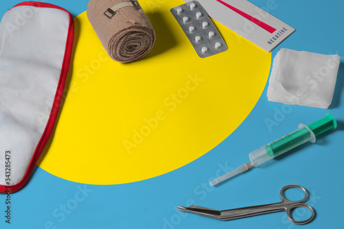 Palau flag with first aid medical kit on wooden table background. National healthcare system concept, medical theme.