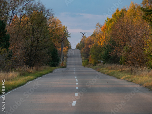 Chernobyl road in exclusion zone. Radioactive zone in Pripyat city - abandoned ghost town. Ukraine