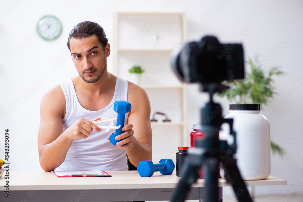 Young male blogger in dieting concept Young male blogger in dieting concept
