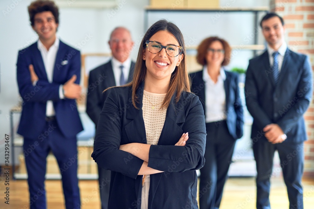 Group of business workers smiling happy and confident in a meeting. Standing with smile on face looking at camera at the office. Group of business workers smiling happy and confident in a meeting. Standing with smile on face looking at camera at the office.