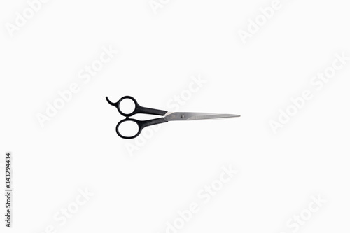 scissors with black handle, steel blades, isolate on white