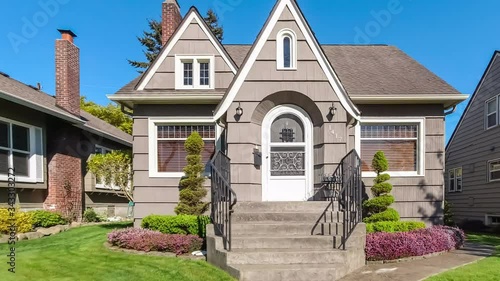 Small suburban Victorian style home exterior approach; 4k dolly shot