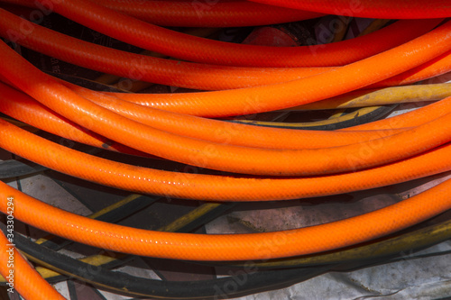 Orange water hoses  © Lynn Freeny