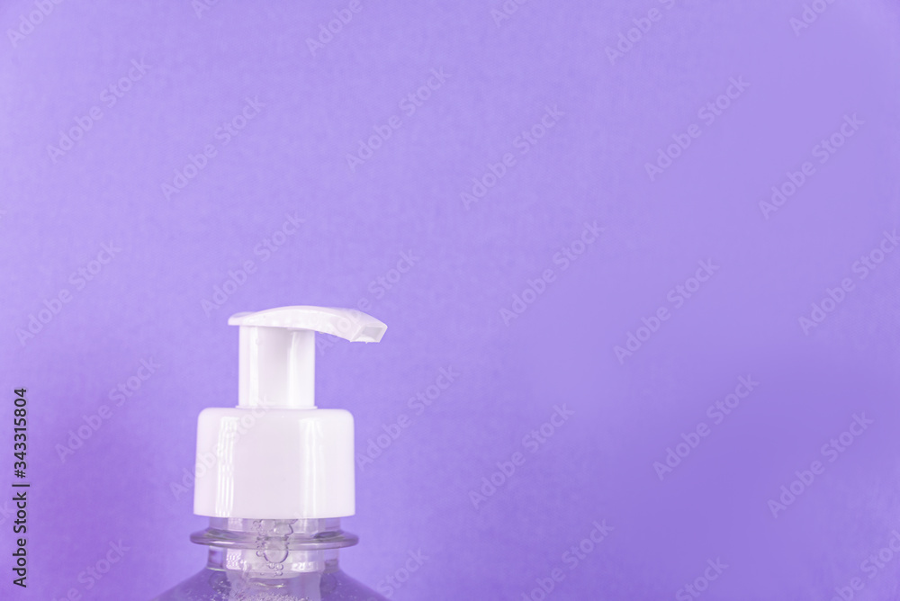 Container with alcohol gel on the light blue background Container with alcohol gel on the light blue background