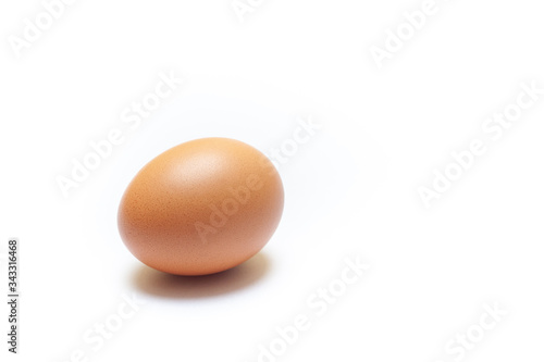 brown chicken egg isolated on white background