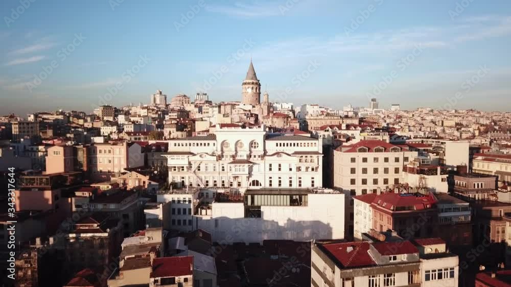 Galata Tower. Istanbul Turkey. Aerial View of Landmark and Tourist Attraction on Golden Hour Sunlight Galata Tower. Istanbul Turkey. Aerial View of Landmark and Tourist Attraction on Golden Hour Sunlight
