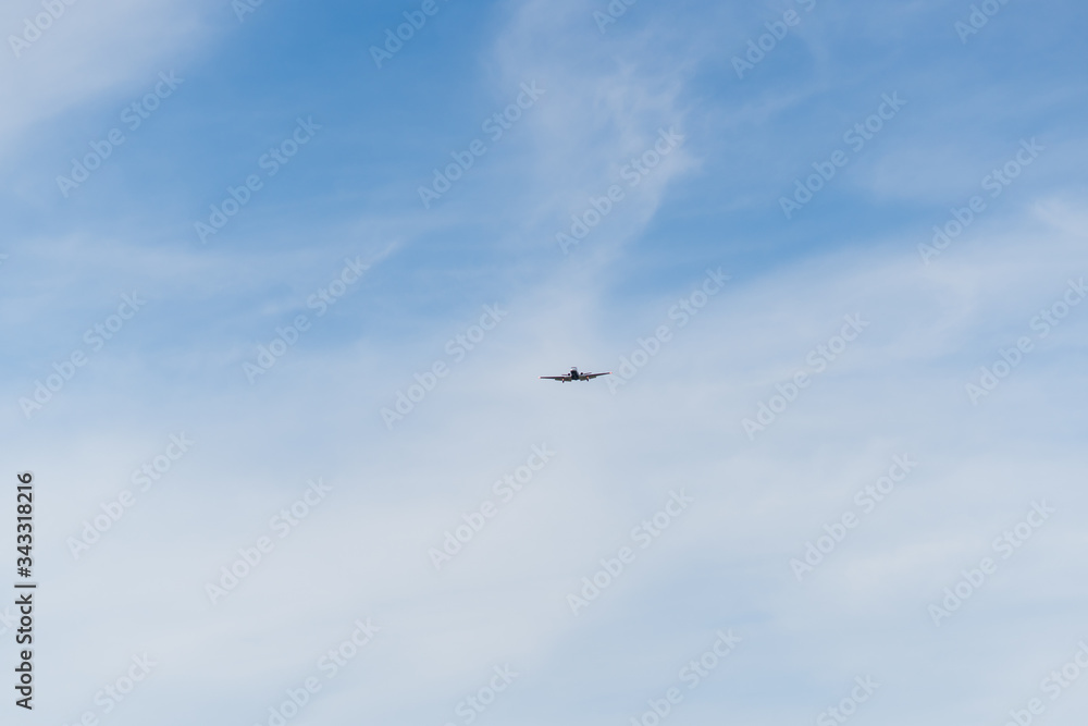 Airplane on a cloudy sky background on a sunny day. Airplane on a cloudy sky background on a sunny day.