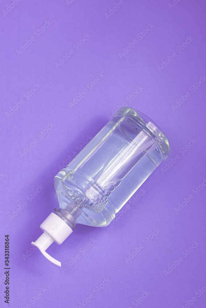Container with alcohol gel on the light blue background Container with alcohol gel on the light blue background