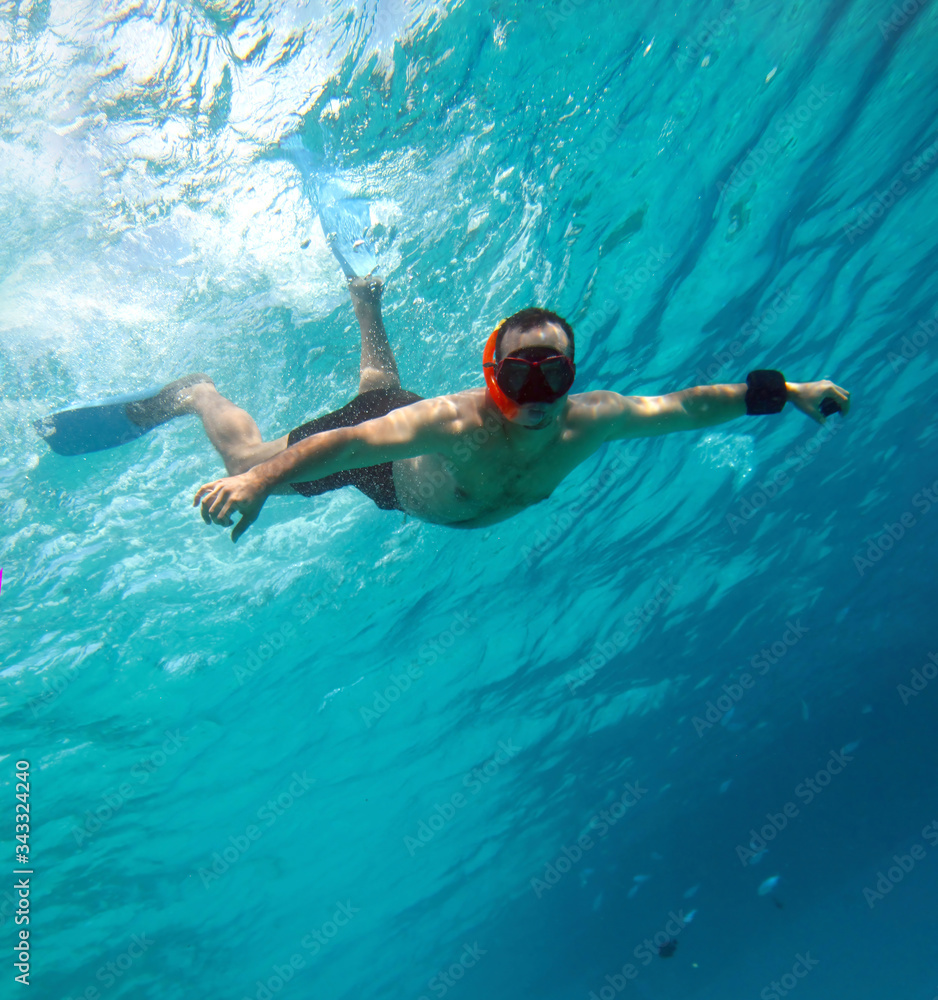 Young man snorkeling underwater,red sea , Egypt .
