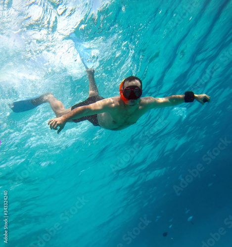 Young man snorkeling underwater red sea   Egypt . 