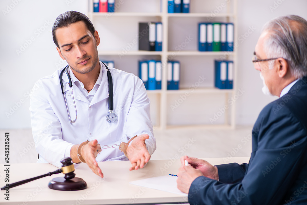 Fototapeta premium Male doctor in courthouse meeting with lawyer