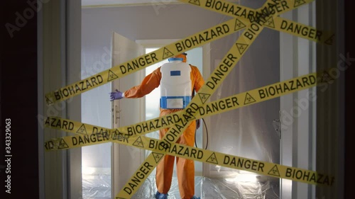 Frontline Worker in Full Hazmat Suit Enters Coronavirus Contaminated Room