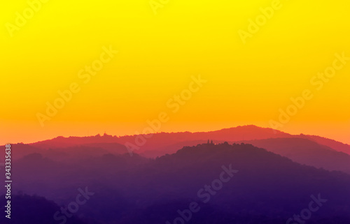 pink and dim purple color in mountain landscape with bright orange sky view