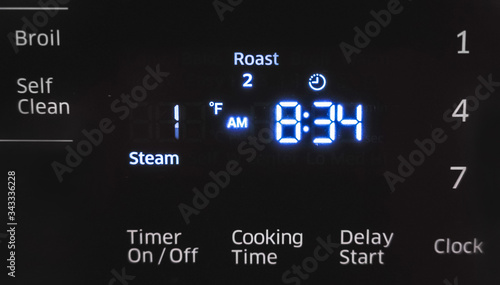 Close up of oven display flickering, control panel blinking. Electricity problem.