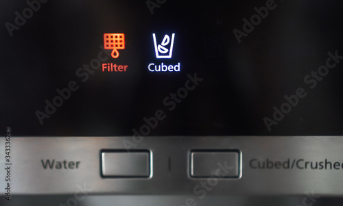 Refrigerator water filter indicator light on.