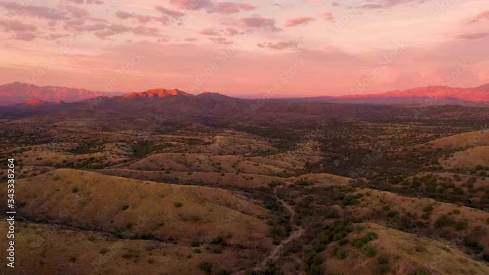 The beautiful fiery colors of sunset over the landscape of Sonoita, Arizona - aerial The beautiful fiery colors of sunset over the landscape of Sonoita, Arizona - aerial