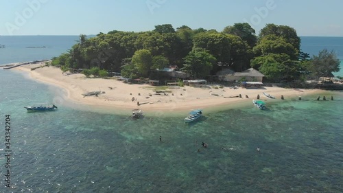 Aerial descending on the beach of Samalona Island and its clear water, Makassar, Indonesia photo