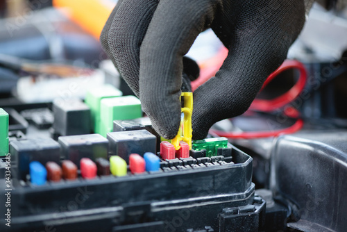 Konstfotografi A car fuse replacement close up.