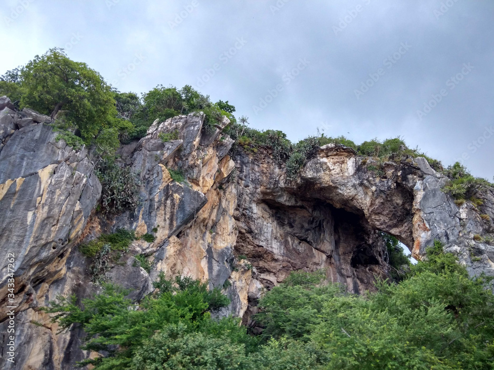 Rocky mountain, resembling a skull by the sea called Thao Kosa frorest park or khao ka lok Prachuap Khiri Khan thailand
