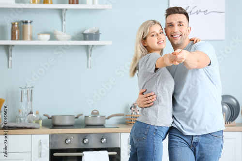 Happy dancing young couple ...