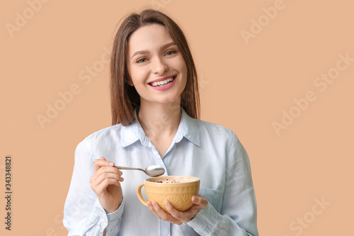 Young woman with tasty yogu...