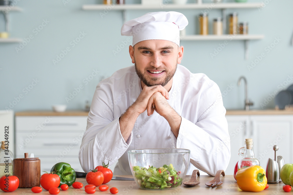 Handsome male chef in kitchen Handsome male chef in kitchen