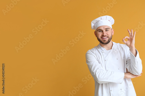 Handsome male chef showing ...