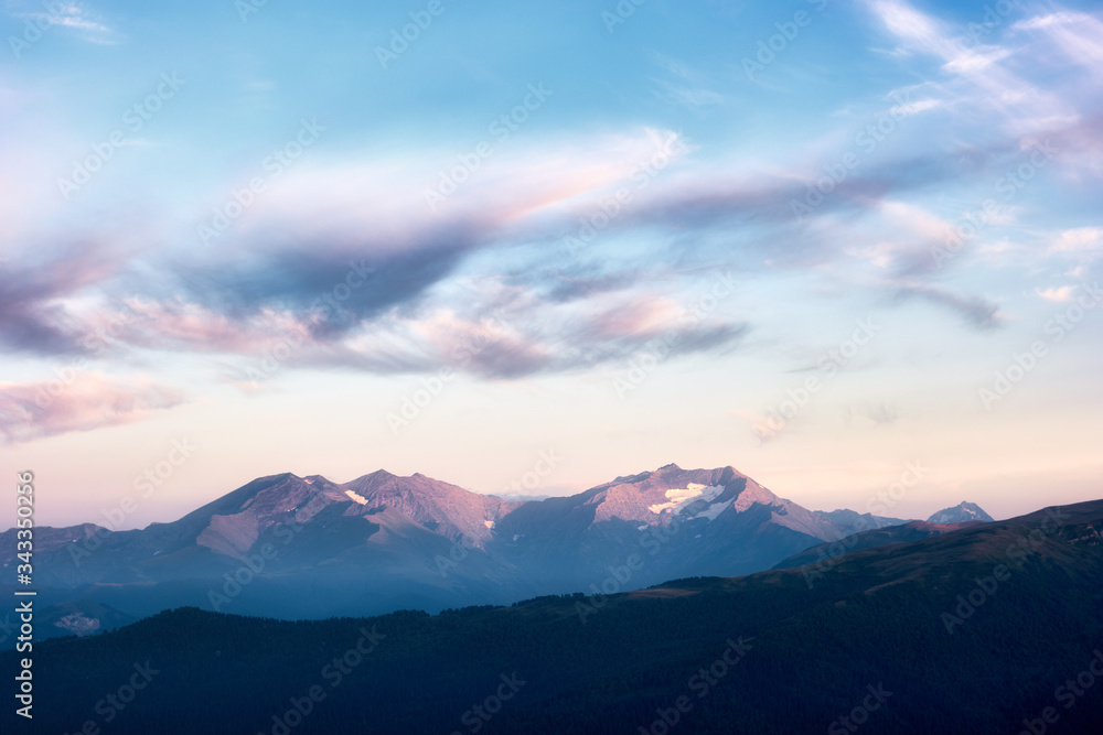 Mountain snow peaks sunset landscape. Caucasian mountains of the Republic of Adygea, Krasnodar region
