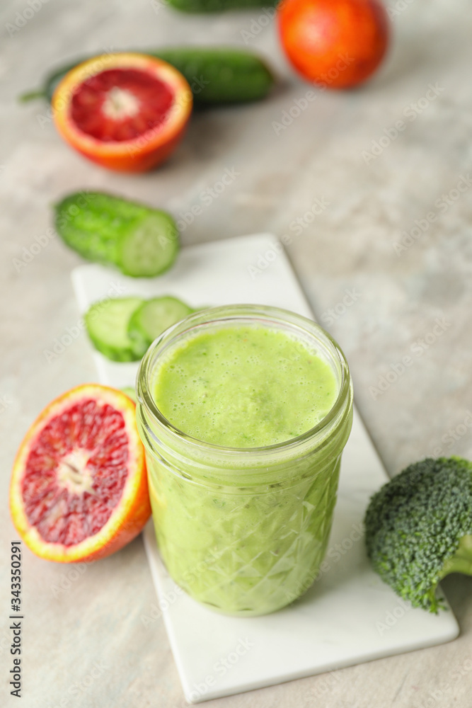 Glass of healthy smoothie and ingredients on table Glass of healthy smoothie and ingredients on table