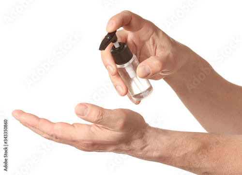 Man using sanitizer on white background