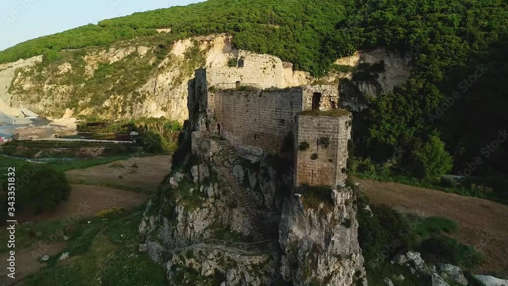 Aerial spinning view of limestone Mseilha Fort and green lush landscape, Hamat, Lebanon Aerial spinning view of limestone Mseilha Fort and green lush landscape, Hamat, Lebanon