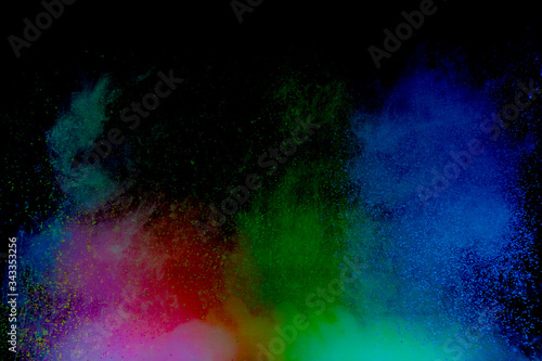 Colorful powder explosion on black background. Colorful dust explode. Paint Holi. © Nat PhotO