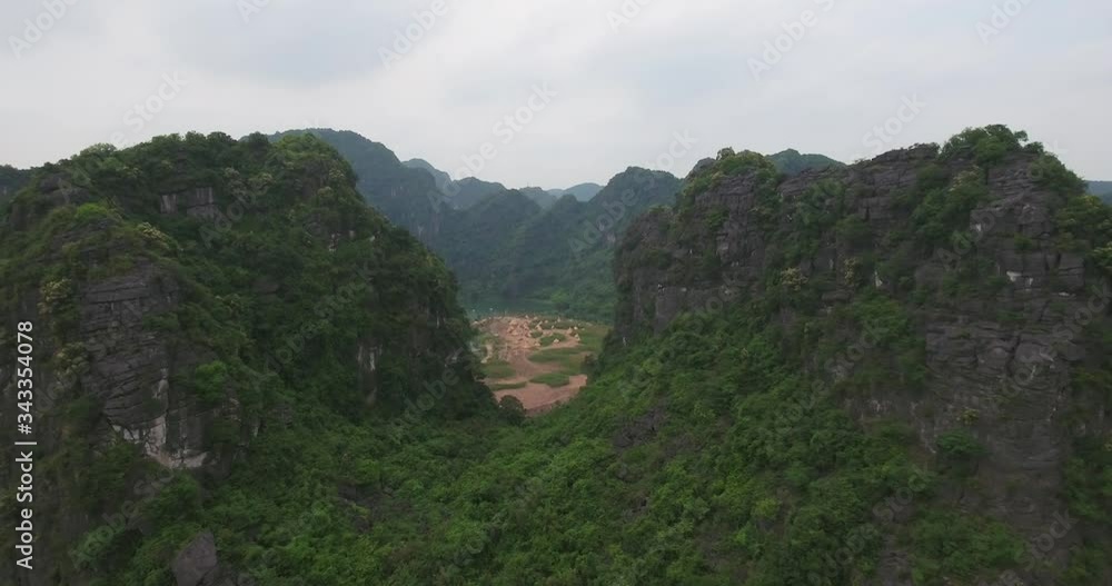 Aerial view of Trang An Scenic Landscape Complex, was inscribed as a UNESCO World Heritage Site, a scenic area near Ninh Binh, Vietnam. The Complex includes Hoa Lu, Tam Coc Bich Dong, Bai Dinh temple Aerial view of Trang An Scenic Landscape Complex, was inscribed as a UNESCO World Heritage Site, a scenic area near Ninh Binh, Vietnam. The Complex includes Hoa Lu, Tam Coc Bich Dong, Bai Dinh temple