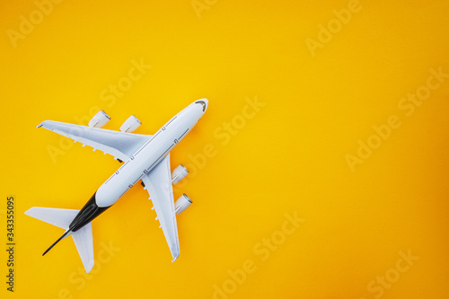 Airplane isolated on yellow background