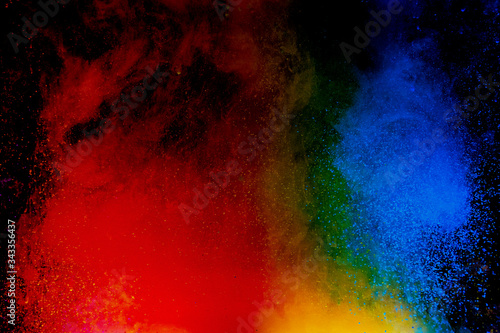 Abstract art powder paint on black background. Movement abstract frozen dust explosion multicolored on black background. © Nat PhotO