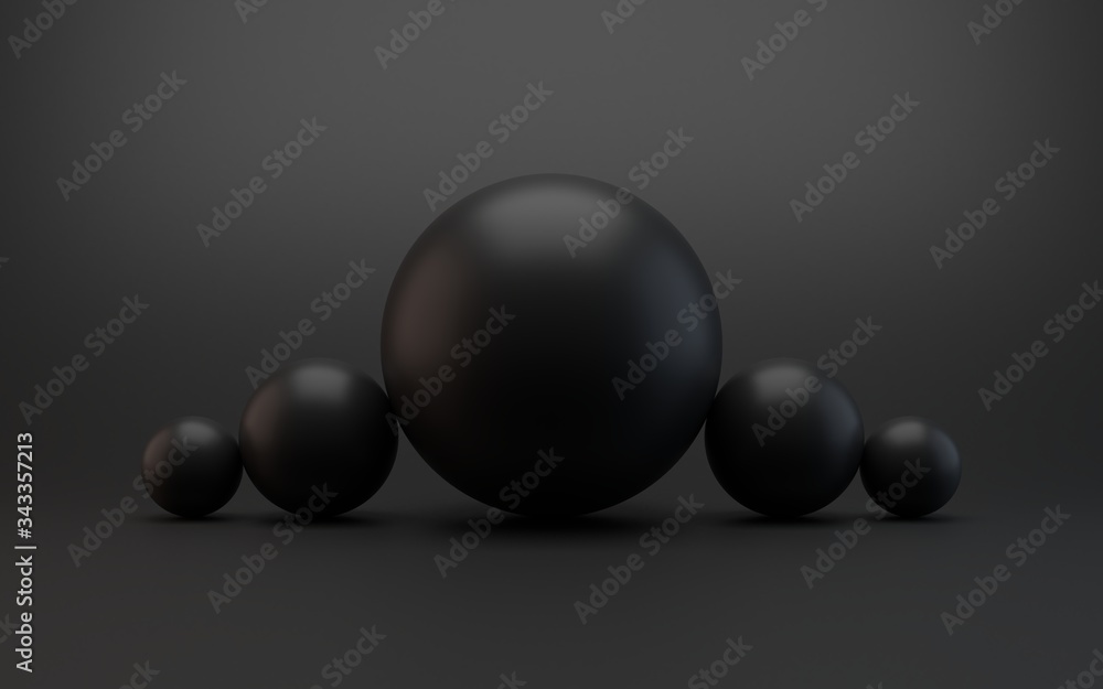 An abstract image of black spheres arranged in a row and forming a pyramid. Black background. Front view. Leadership or team concept. An abstract image of black spheres arranged in a row and forming a pyramid. Black background. Front view. Leadership or team concept.