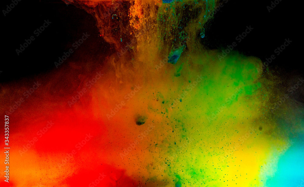 Fototapeta premium Abstract art powder paint on black background. Movement abstract frozen dust explosion multicolored on black background.
