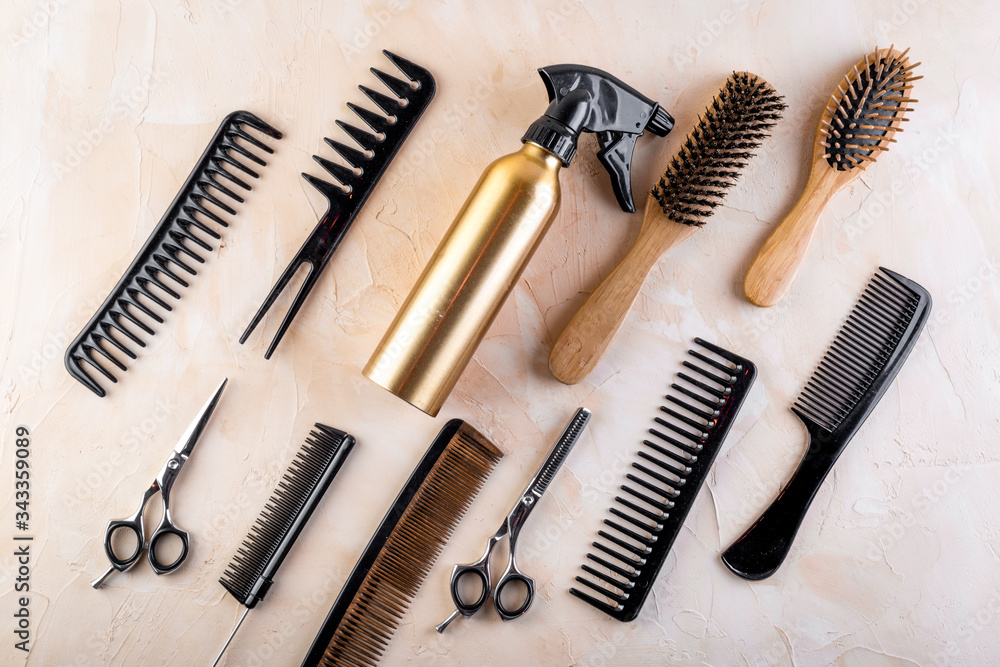 Hairdresser tools. Flat lay on grey background top view Hairdresser tools. Flat lay on grey background top view