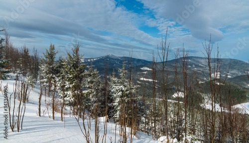 Lysa hora and Travny hills in winter Moravskoslezske Beskydy mountains in Czech republic photo